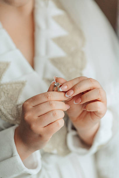 istock A woman is holding a ring in her hand 2210338820