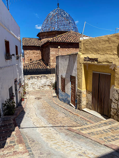 View of a closed alley with a small hermitage at its end in the old town of Sagunto in the Valencian Community, Spain