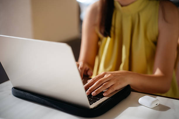 istock Close-Up of Remote Work with Laptop and Earbuds 2210341278