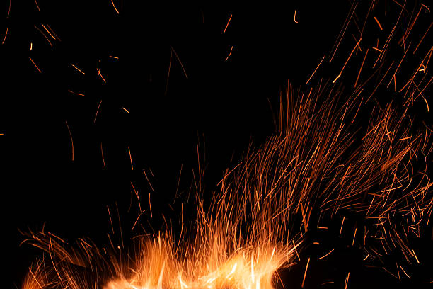 istock sparks from the fire glowing in the dark 2210349935