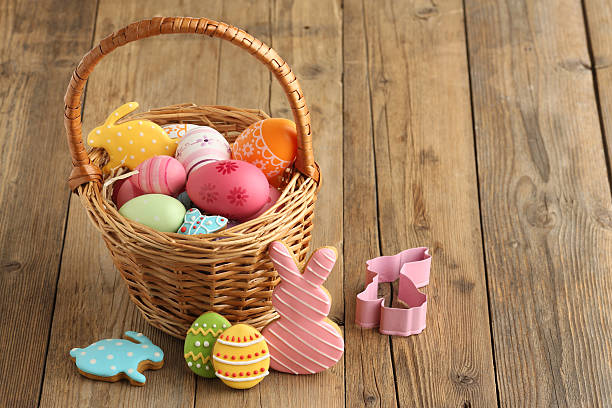 istock Easter biscuit moulds in pastel colours. Easter egg, bunny and chicken. Happy Easter day concept. Minimal concept. Space for text. Easter cookery on the background of baked goods. 2210352879