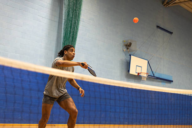 Man Playing Pickleball Indoors
