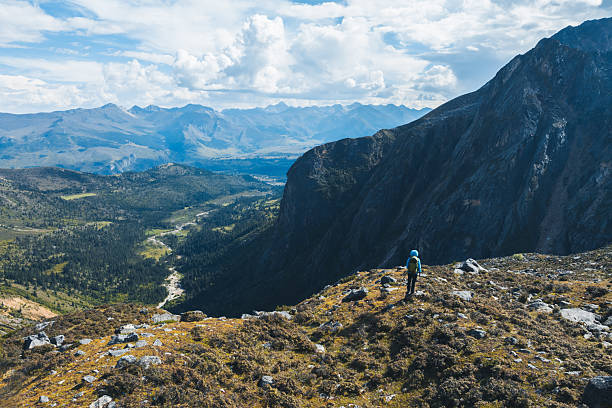 Woman hiking on high altitude mountains