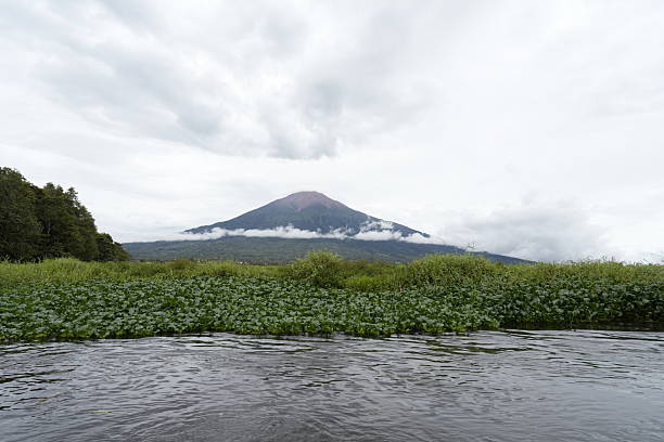 Jesus and Mary beach on island Ometepe in Lake Nicaragua with volcano Conception in background, Nicaragua in Central America. Volcano Conception is one of the most perfectly shaped volcanos of the Americas and the second highest, 1610 m in Nicaragua and is active volcano with last activity in March 2010.