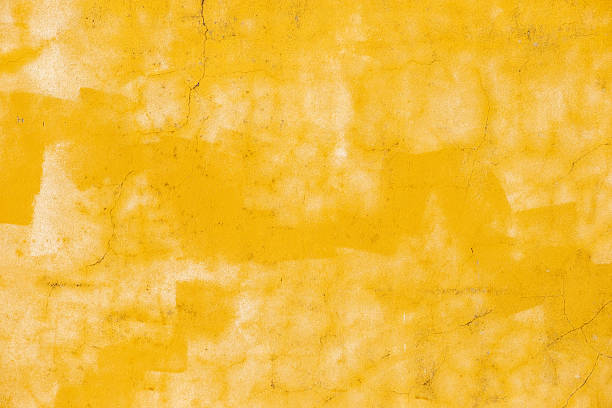 istock wall badly painted white and yellow and cracked, texture background for design 2210355812