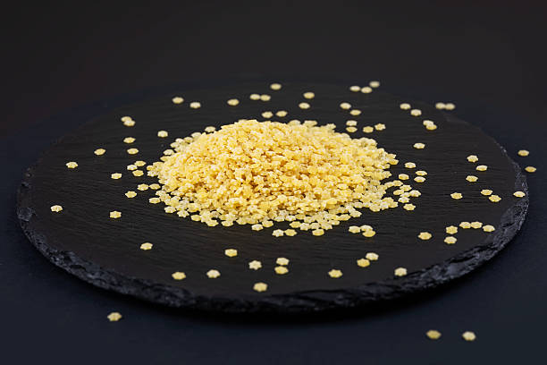 istock Dry star shaped stelline pasta close-up. World Paste Day concept 2210356459