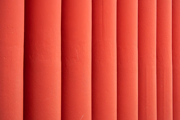 Red painted concrete bars on a building