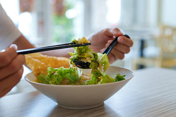istock Malaysian asam laksa with fresh vegetables served in ceramic bowl 2210358148