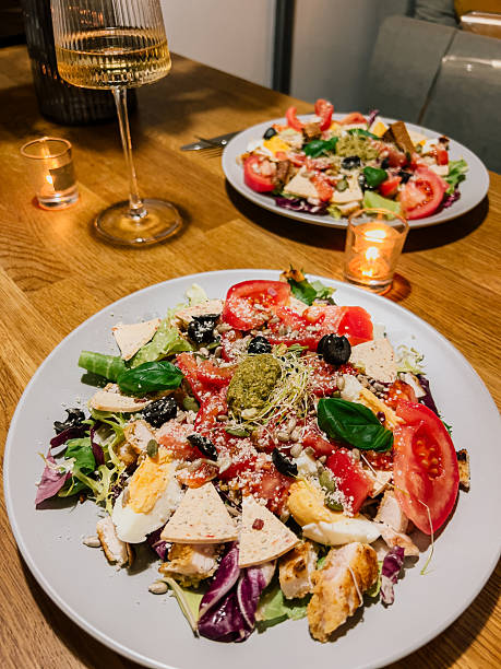 istock Fresh vegetables with egg and pesto, vegetables combined with cheese and herbs, vegetables artfully served on plate. Leafy greens with tomato, egg and croutons, greens and toppings create health plate 2210358490