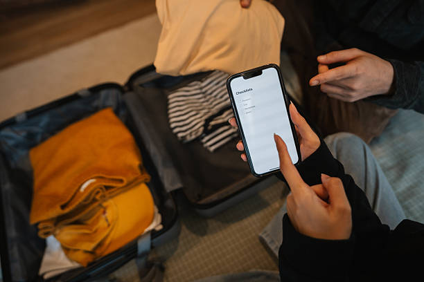 istock Young couple packing for vacation 2210358731