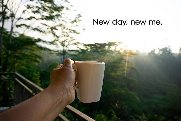 istock Morning coffee in hand with positive motivation words. 2210362394