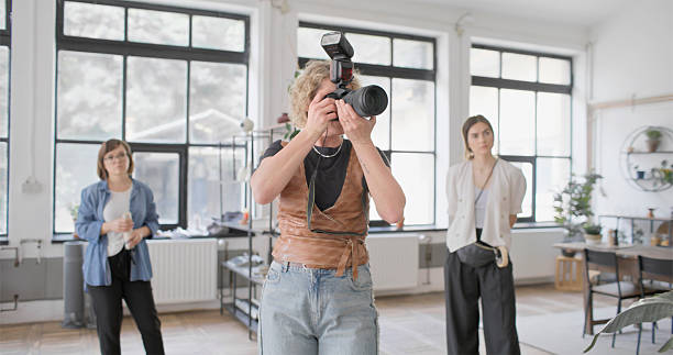 istock Bright Studio Set with Diverse Team and Photographer Capturing Creative Moments 2210363516