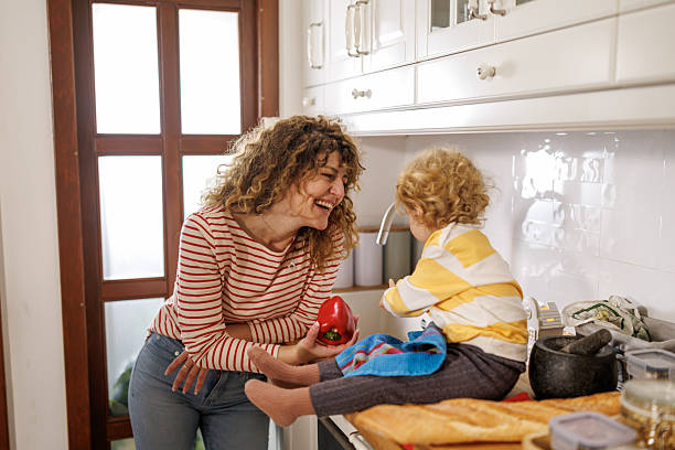 istock Helping mom with chores at home 2210363937