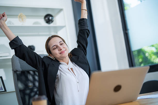 istock Office worker enjoys a moment of relaxation while taking a break from computer tasks 2210367403