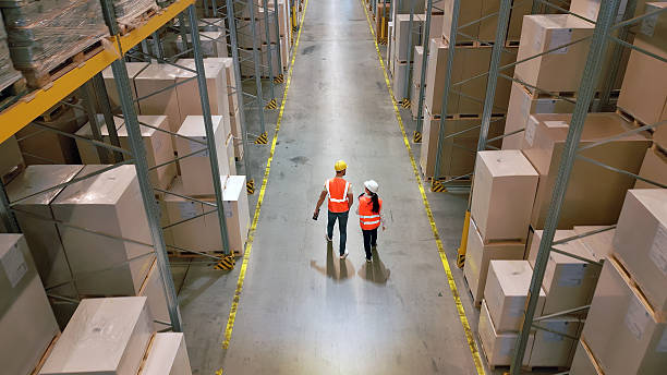 istock Efficient warehouse workers navigate aisles in a busy global supply chain. 2210370508