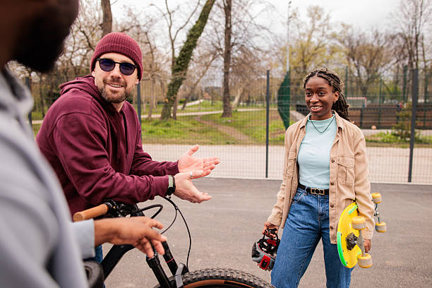 Young couple riding tandem bicycle