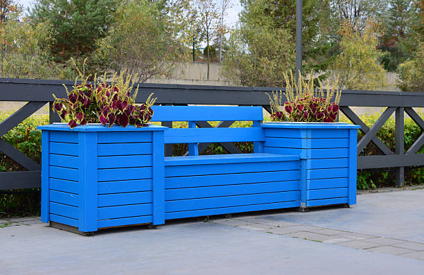istock a blue wooden bench with no people isolated 2210371590