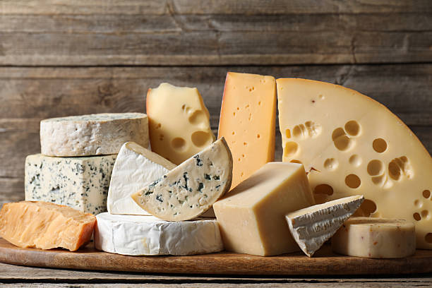 istock Different types of cheese on wooden table 2210374278