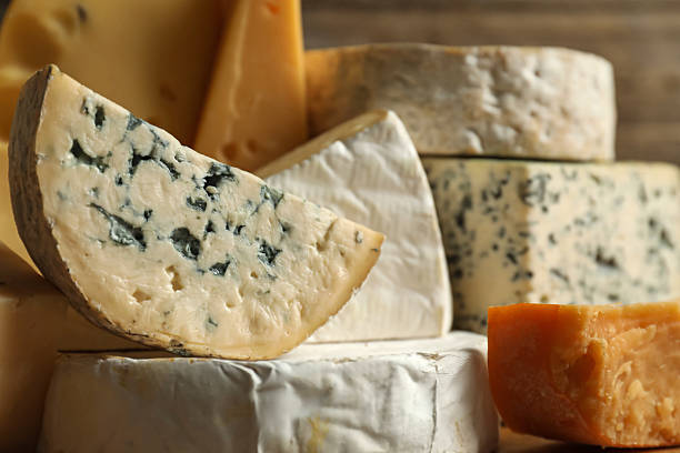 istock Different types of cheese on blurred background, closeup 2210374387