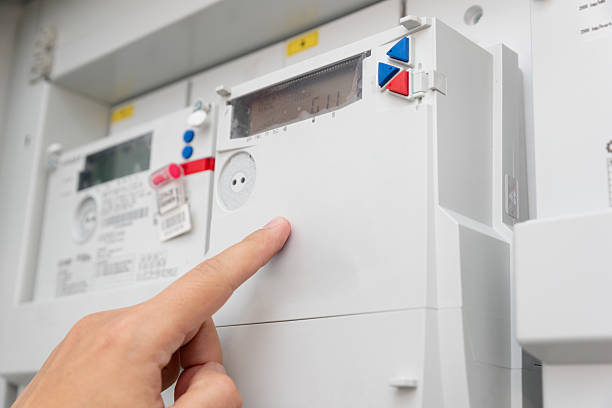 istock Man checking household electricity meter 2210374527