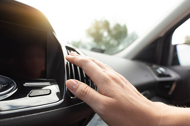 istock Woman check air condition in car 2210374640