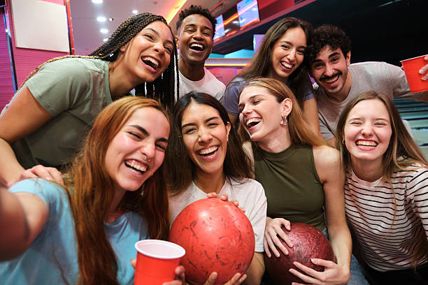istock Group of friends taking a selfie while bowling and having fun 2210375641
