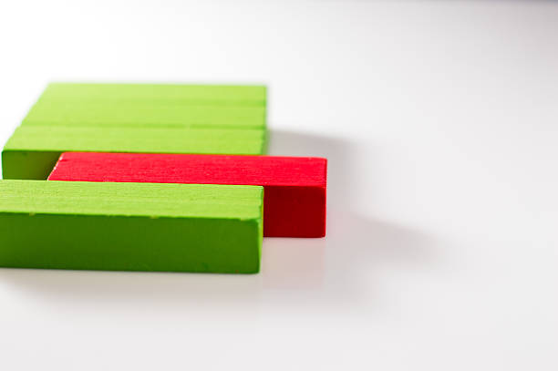 Wooden blocks look like part of a didactic set. The colored elements go well together. Toy sticks are used for coordination exercises.