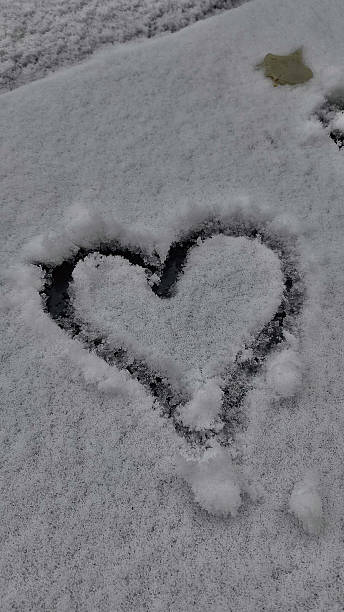 istock Heart drawn in the snow 2210378258