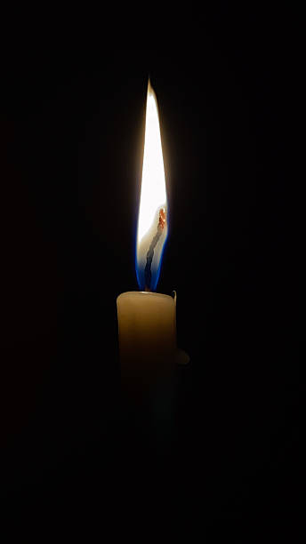 istock Glowing Candle in the Dark 2210378289