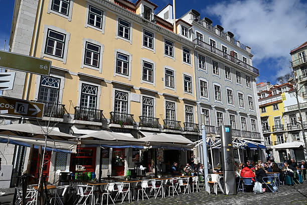 Lisbon, Portugal, march 23, 2025 : Restaurant terraces with customers in the Baixa district of Lisbon