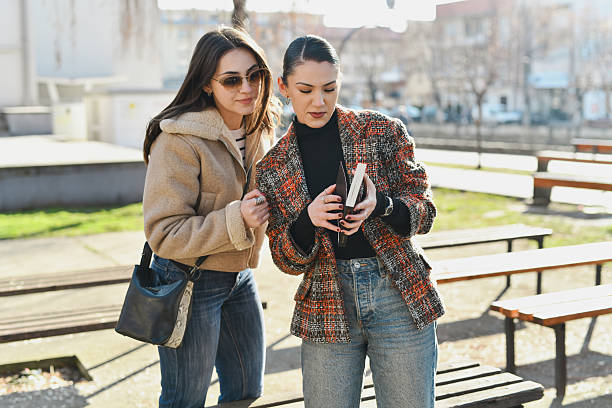 istock Females Looking Focused Checking First Pages of New Book 2210383005