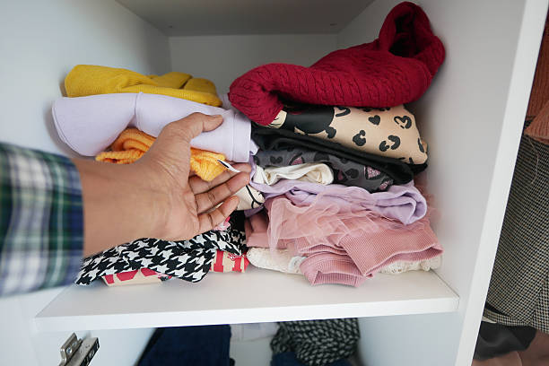 istock Clothes That Are Neatly Organized Within a Stylish Modern Wardrobe 2210384537