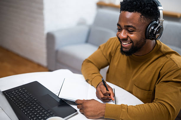 istock Remote African worker participating in online class at home 2210386558