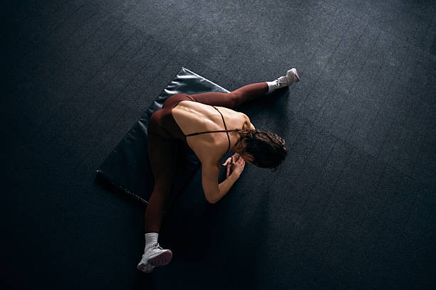 Child gymnast girl doing exercise at gymnasium