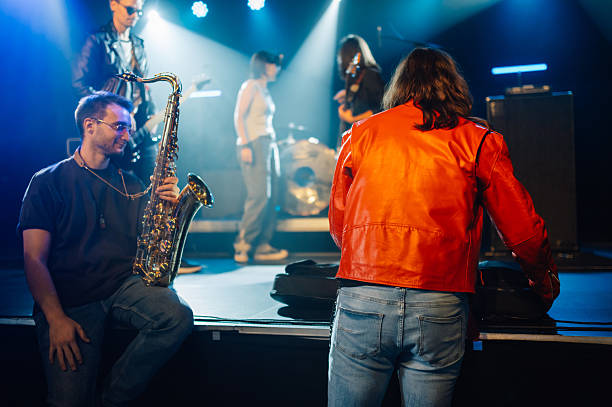istock Musicians preparing to perform live on stage during a concert 2210390422