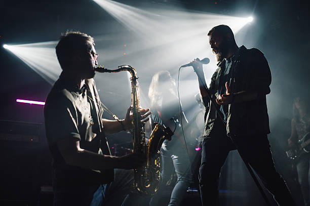istock Group of musicians performing live on stage 2210390427