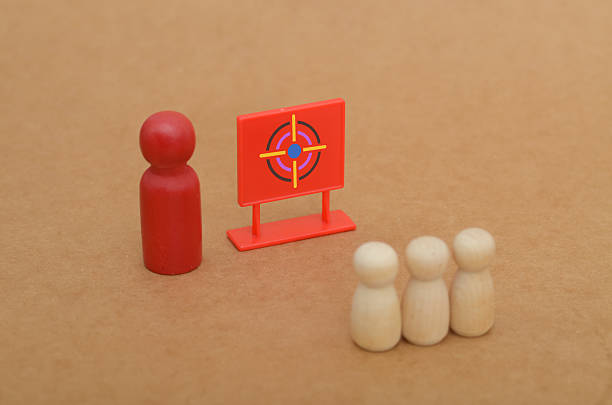 istock Focused Leadership Concept with Red Figure and Observing Group by Target 2210392823