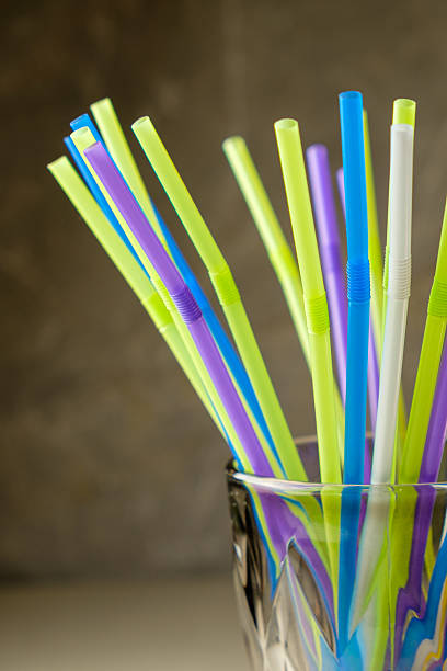 istock Colorful straws in a glass create a vibrant display for summer drinks 2210393379