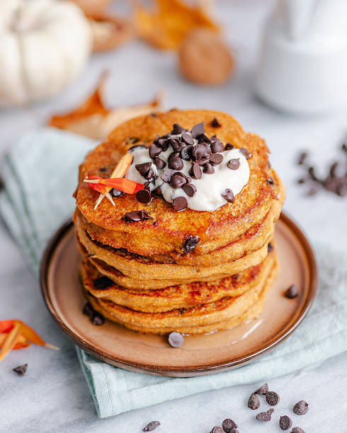 Pumpkin pancakes with yoghurt, chocolate chips and syrup