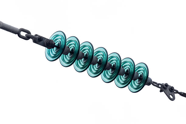 Electrical insulators made of glass on a cable, isolated on white.