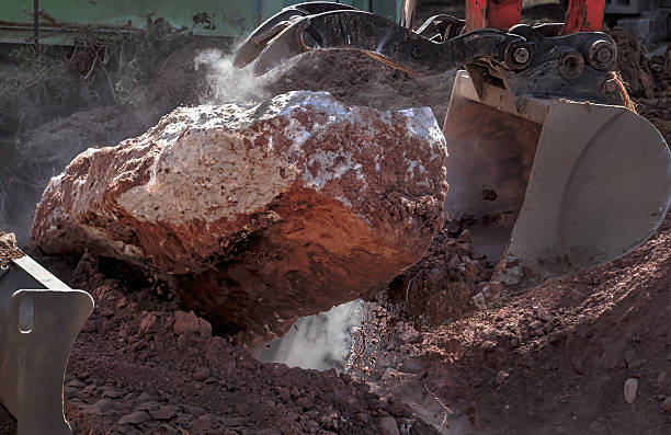 istock Foundation demolition with claw excavator 2210397280