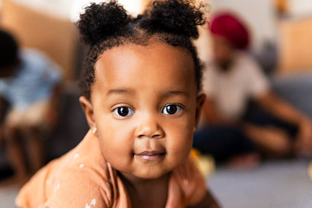 istock Adorable baby girl crawling and exploring home environment 2210398685