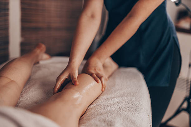 istock Woman Receiving a Relaxing Leg Massage 2210400996