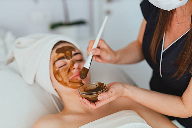 istock Beautician Applying Alginate Mask at Spa 2210401381