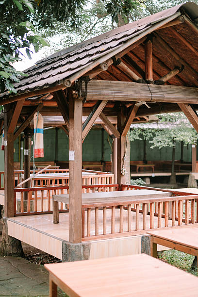istock Rustic wooden gazebo nestled in a tranquil outdoor setting 2210401985