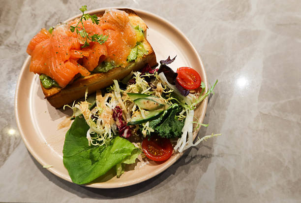 avocado salmon toast with salad on the side