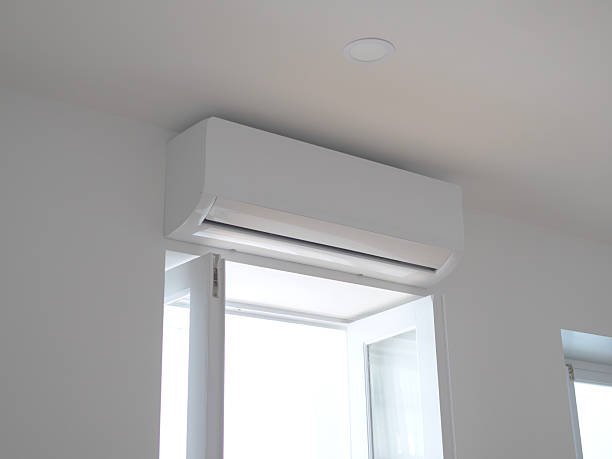 istock Modern air conditioning unit installed in a bright room 2210404543