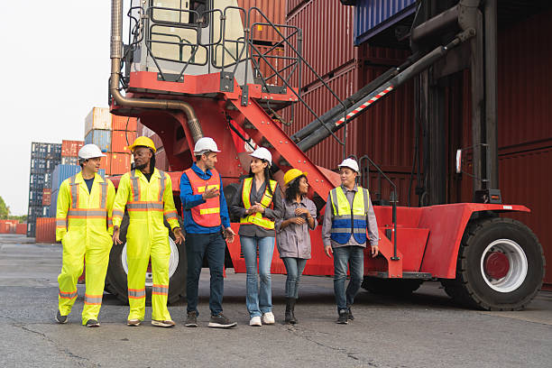 istock Happy business people engineer and worker team in industry containers yard, Success teamwork concepts 2210405582