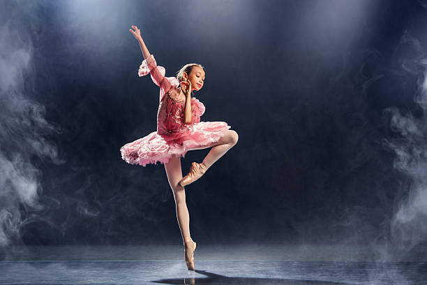 istock Graceful Ballet Performance by Young Dancer in Pink Tutu 2210405594