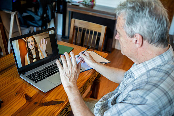 istock Senior man making video call at home 2210406880
